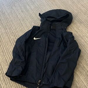 Nike Dark Navy Jacket with Hood Nike shield.  Used as rain coat
